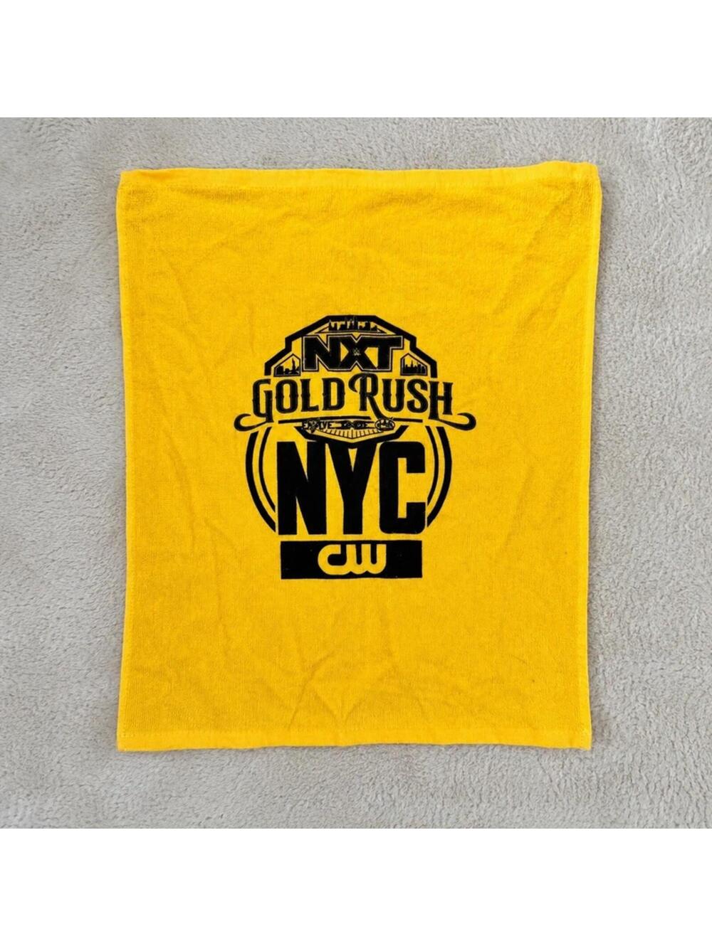 WWE NXT gold rush NYC CW yellow rally towel wrestling event merch